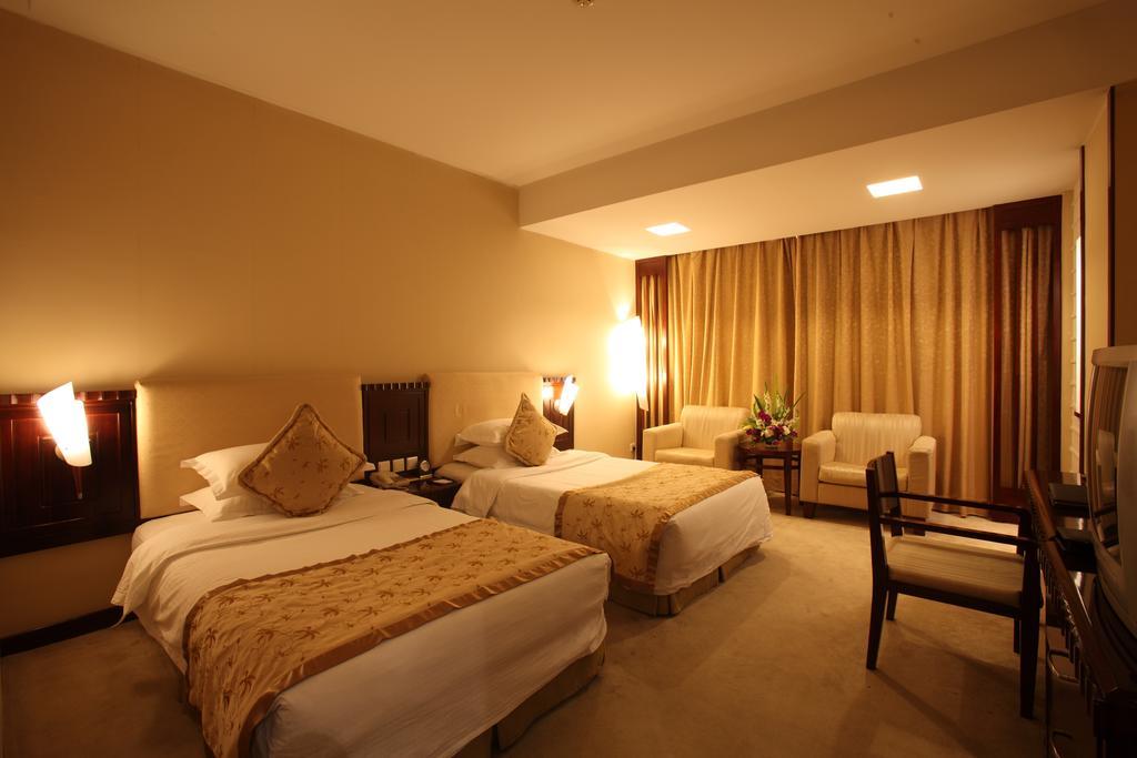 Beijing Wuhuan Hotel Quarto foto