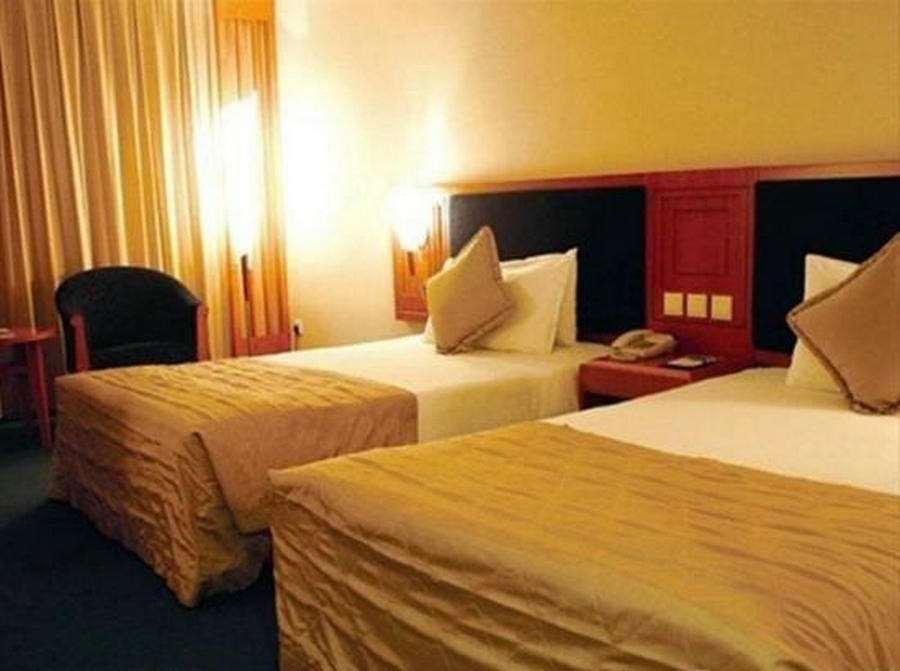 Beijing Wuhuan Hotel Quarto foto